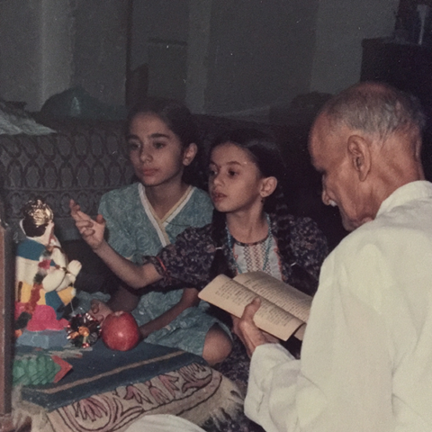 Baba and grand daughters doing Ganesh pooja at his residence